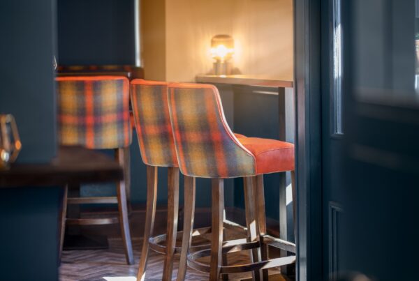 Luxury tartan upholstered bar stools, interior fabric project at The West Bar and Restaurant Mayo, by The Design Barn, County Galway
